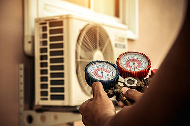 Professional Heat Pump Repair technician working in Lawrenceburg, IN